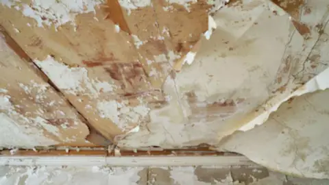 Peeling, water-stained ceiling